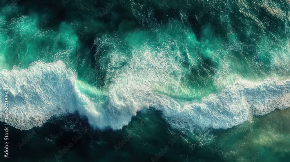 Poster aerial view of dynamic ocean waves crashing and creating white foam over deep blue and turquoise wat