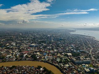 Coastal city with river and building. Davao City. Mindanao, Philippines.