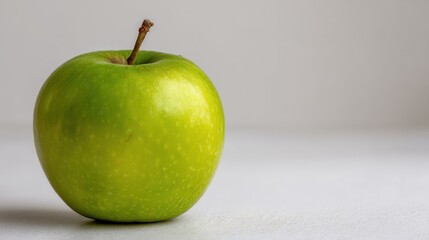 Close-up of a single green apple