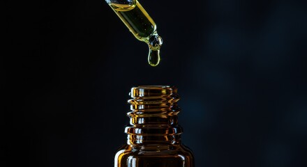Naklejka premium Close up of essential oil dropper filling amber bottle detailed