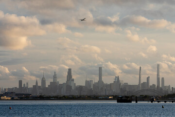 Airplane taking off above the New York City skyline