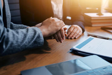 Judge gavel with Justice lawyers having team meeting at law firm background. Concepts of Law and Legal services.