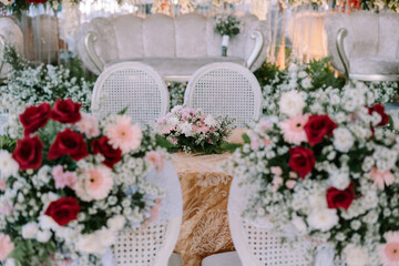 Elegant wedding reception decor with floral arrangements and soft lighting