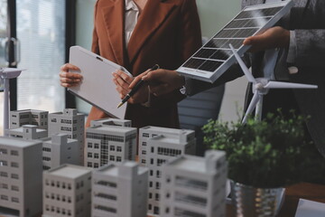 Discussion among businesspeople on the latest developments in solar cell panel technology and Solar...
