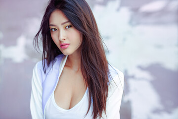 Close-Up Portrait Of Stylish Young Asian Woman With Long Hair And Confident Look