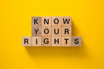 Know your rights written on wooden blocks on yellow background