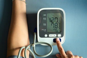 Man check blood pressure monitor and heart rate monitor with digital pressure gauge. Health care...