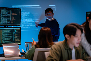 Asian software engineer or programmer team working late in development office,problem solving or algorithm of ai assistant helping for work.software developer,digital technology security concept