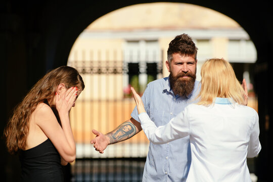 Fototapeta Cheating. Emotional treason. Cheating couple. Man lied, cheated, and betrayed. Treason of the heart. Emotional treason. Feel cheating. Man cheating his wife or girlfriend. Love triangle and threesome.