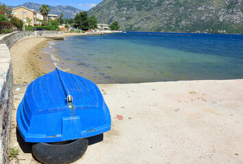 An upturned boat on the beach by the Bay of Kator