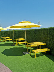 It is an outdoor cafe with parasols.
