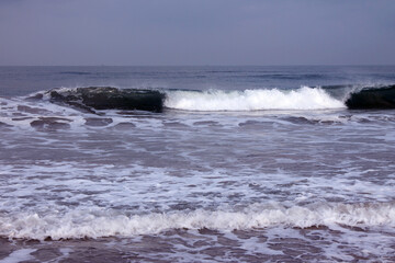 Ocean waves under clear blue sky