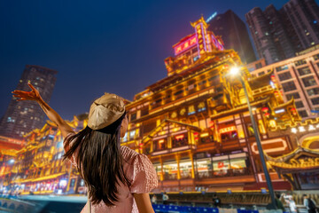 Young Asian woman enjoying at Hongya Dong the tourist destination in Chongqing, China