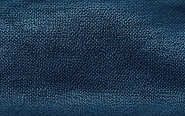 Close-up texture of dark blue woven fabric showing detailed pattern and fibers