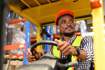 warehouse worker driving a forklift at shipping warehouse. Industrial engineer man in safety vest...