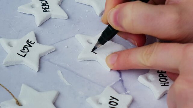 Master class writing word DREAM Unrecognizable artist do it yourself air dry clay crafts for Christmas tree decor holiday. Decoration gift idea Handmade children craft. Step by step instruction of