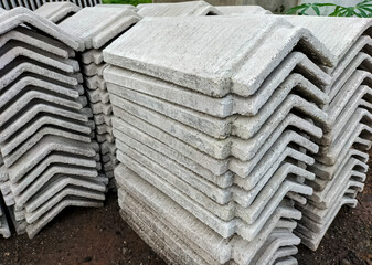 Pile of concrete triangle blocks for roofing sheet. Building's covering. Selective focus. 