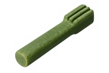 Close-up green dental stick highlighting pet oral hygiene, situated against clean transparent surface