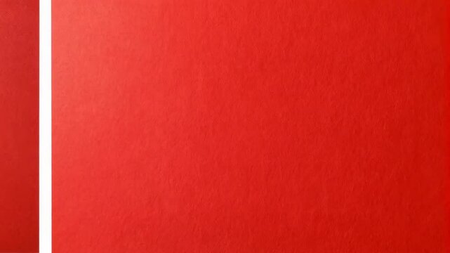Abstract red paper background with grid overlay and ripped edges creating a unique textured surface with bright vibrant color.