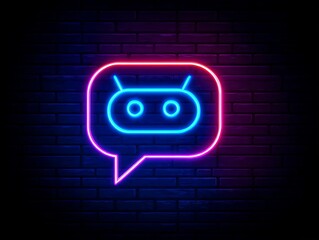 Neon robot icon with speech bubble in vibrant colors on brick wall.