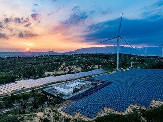 Solar photovoltaic windmill wind energy at sunset