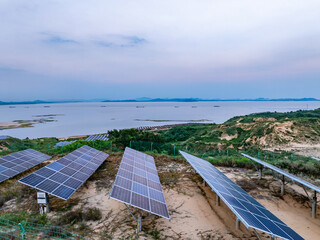Solar photovoltaic windmill wind energy at sunset