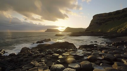 A coastal sunset over a rocky shore, where the sky is painted with a dramatic display of clouds. The setting sun casts a warm, golden - orange glow on the rough, jagged rocks below, and the waves cras