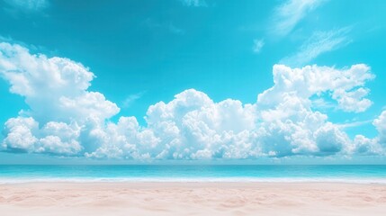 Obraz premium summer concept. Vibrant blue sky with fluffy clouds over serene ocean waves and sandy beach.