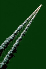 Fototapeta premium Rocket exhaust trail against dark green background