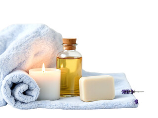 Still life of spa essentials with towel candle oil and soap on white cloth against black backdrop
