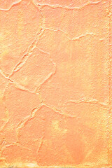 Textured orange wall with subtle cracks and pattern