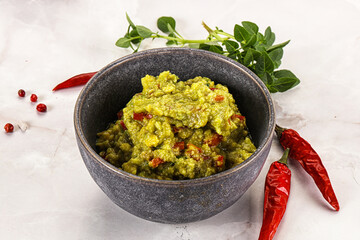 Guacamole with avocado, tomato and chili