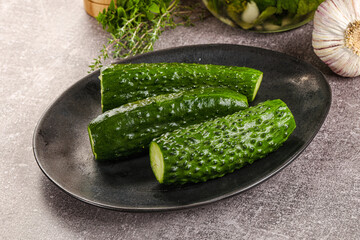 Homemade lighty salted cucumbers with herbs