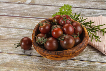 Juicy ripe black cherry tomato