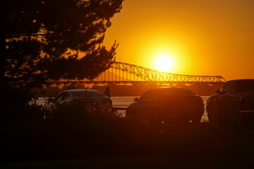 Kennewick Washington sunset with bridge and cars in silhouette 