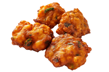 Crispy golden vegetable Indian fritters Pakoras with herbs, isolated on white transparent background, concept of traditional snack