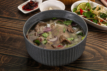 Vietnamese Pho Bo soup with beef and noodles