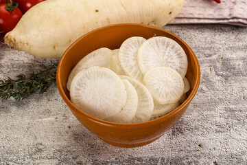 Sliced white daikon radish in the bowl
