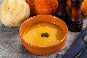 Vegan pumpkin cream soup served sesam