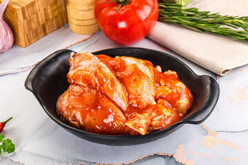 Raw marinated uncooked chicken wings