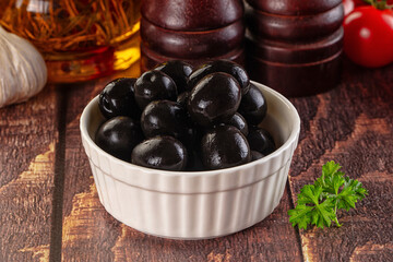 Mediterranean marinated Black olives in the bowl