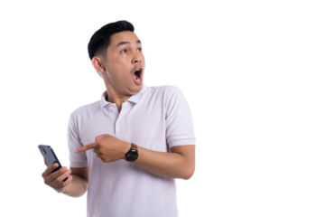 Shocked young man pointing at smartphone with surprised facial expression isolated on transparent background