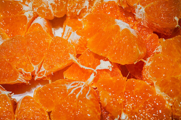 Fresh Orange Slices on Orange Background – Citrus Fruit Texture and Pattern