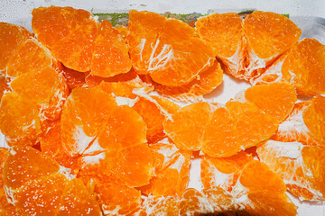 Fresh Orange Slices on Orange Background – Citrus Fruit Texture and Pattern