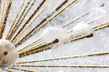 A large, ornate, gold and white sculpture with a lot of detail