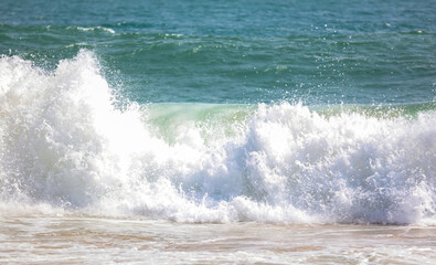 The ocean is rough and the waves are crashing