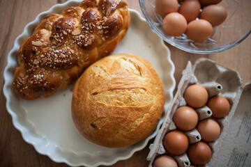 Homemade bread and eggs on rustic kitchen table