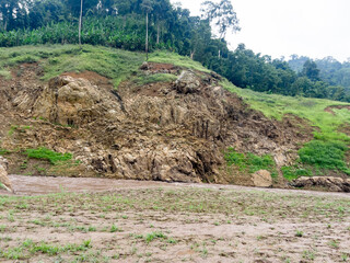 After heavy rain, the flood water from the highlands flows into the river. The water is muddy and has lots of wood chips and other things.