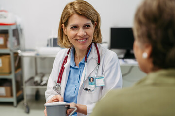 Senior woman having blood pressure checked, preventive care.