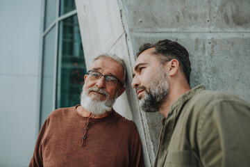 Portrait of handsome mature man and his older father.